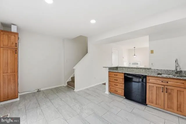 a view of cabinets and wooden floor
