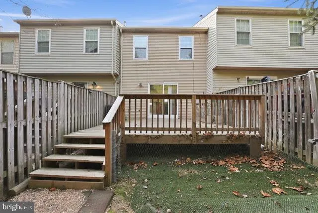 a view of a balcony with wooden floor