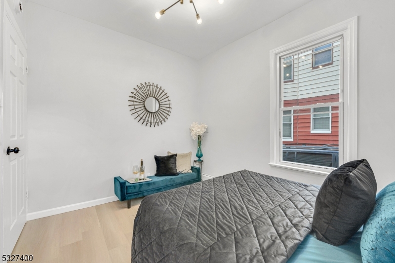 30 Allen Street Irvington, NJ 07111 - Photo 12 of 17 a bedroom with a bed and a window