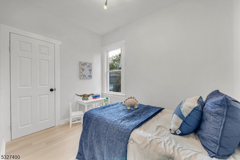30 Allen Street Irvington, NJ 07111 - Photo 15 of 17 a bedroom with a bed and a window