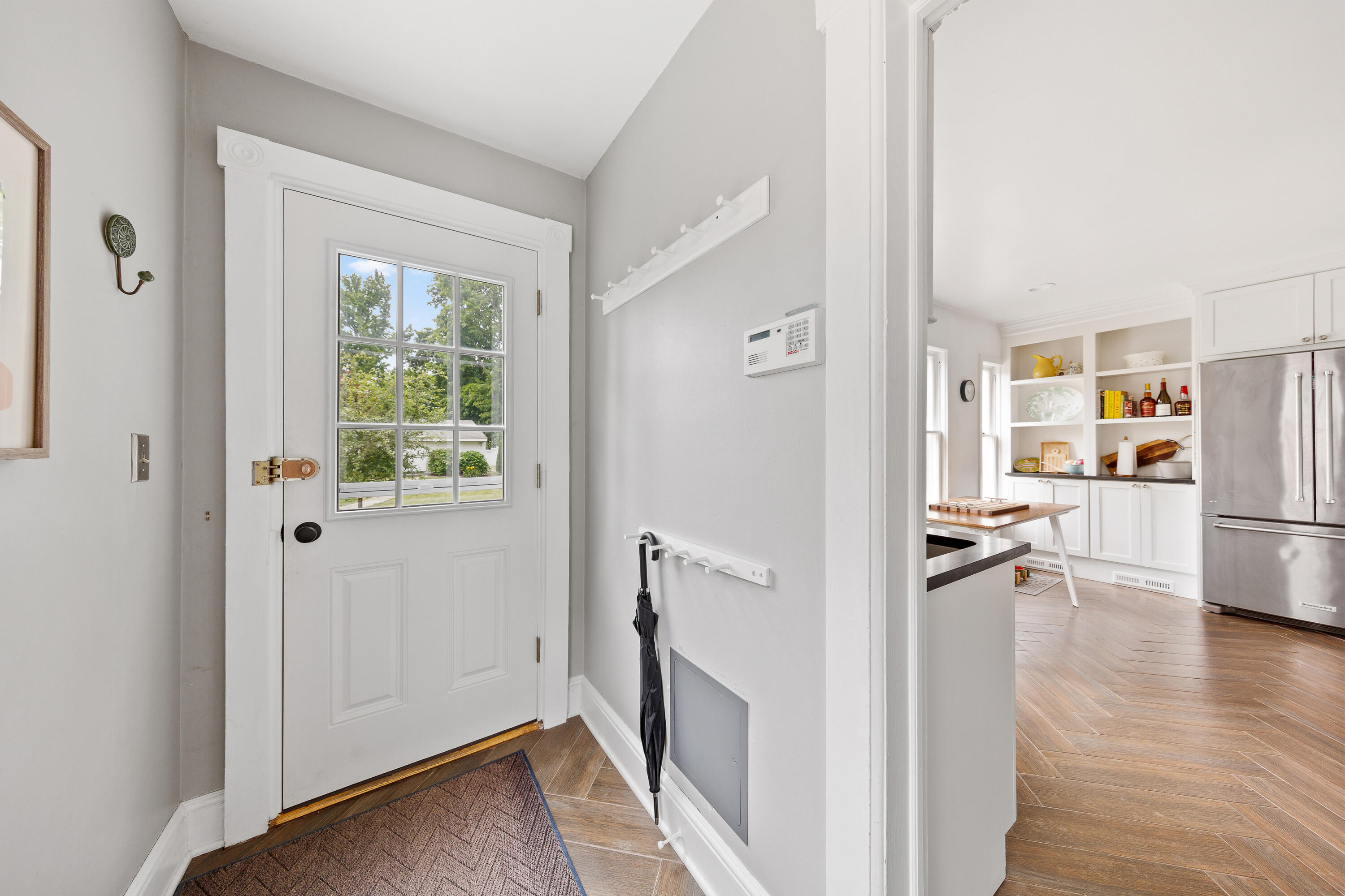 25 Raymond Street Darien, CT 06820 - Photo 11 of 28 a view of a kitchen with wooden floor and a refrigerator