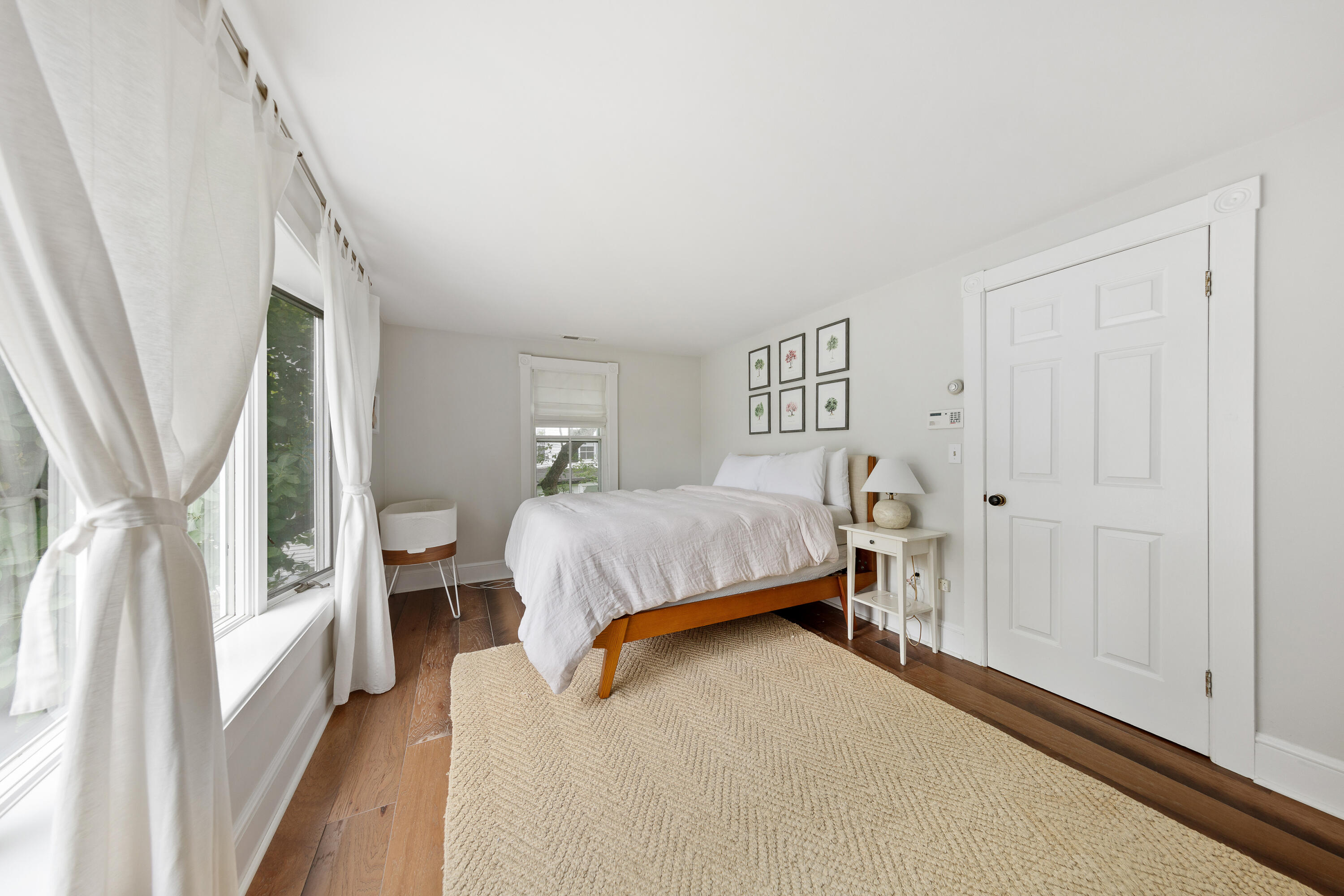 25 Raymond Street Darien, CT 06820 - Photo 12 of 28 a bedroom with a bed couch and a window
