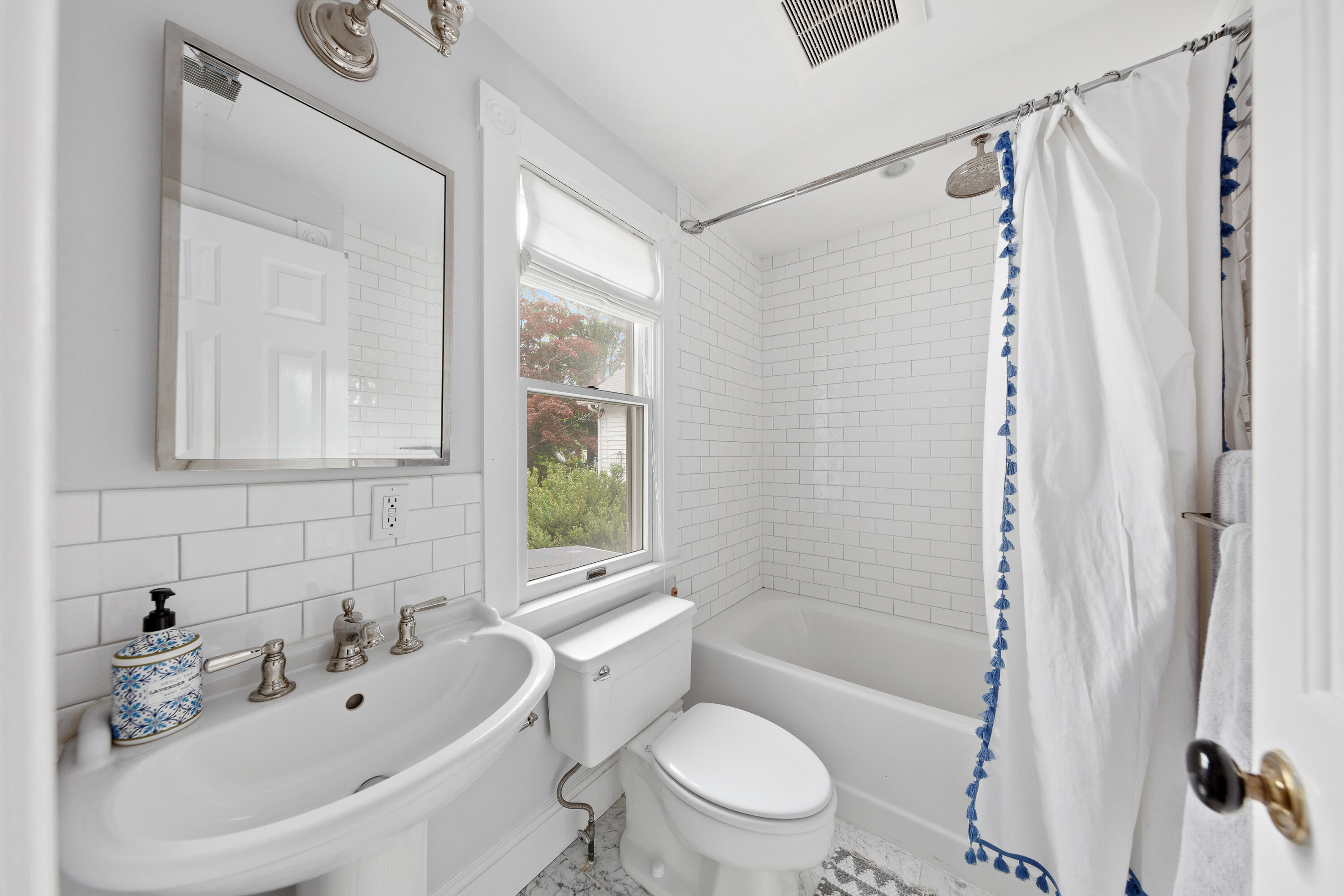 25 Raymond Street Darien, CT 06820 - Photo 13 of 28 a bathroom with a sink a toilet and shower