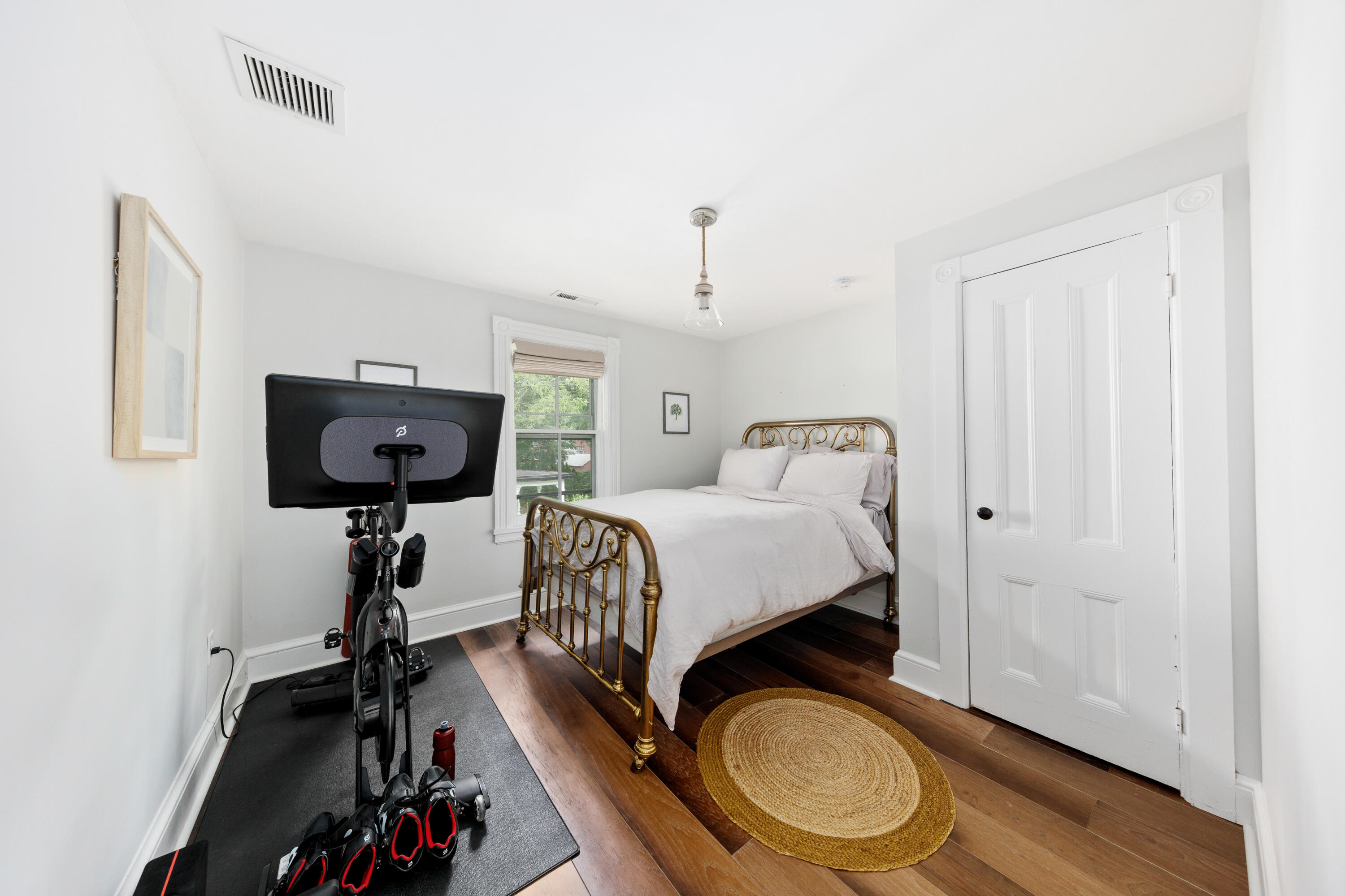 25 Raymond Street Darien, CT 06820 - Photo 15 of 28 a bedroom with a bed and wooden floor