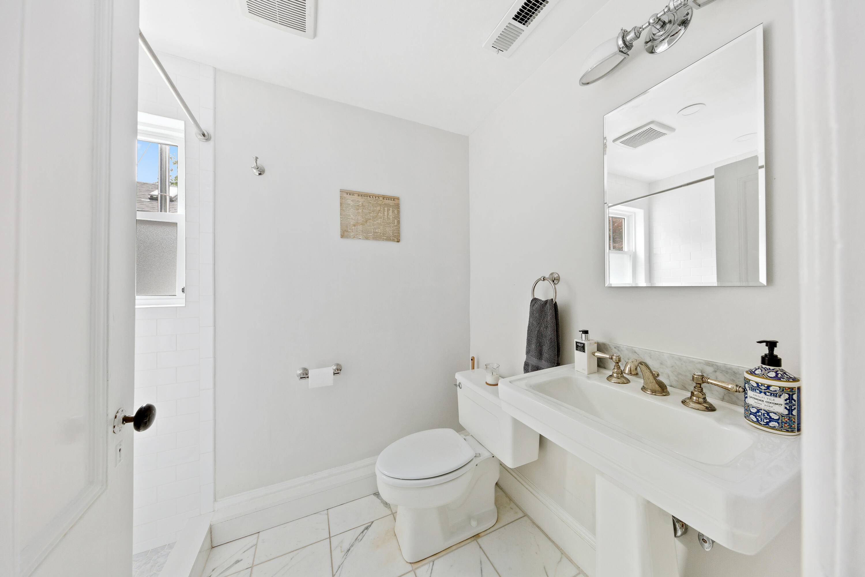 25 Raymond Street Darien, CT 06820 - Photo 16 of 28 a bathroom with a sink toilet and shower