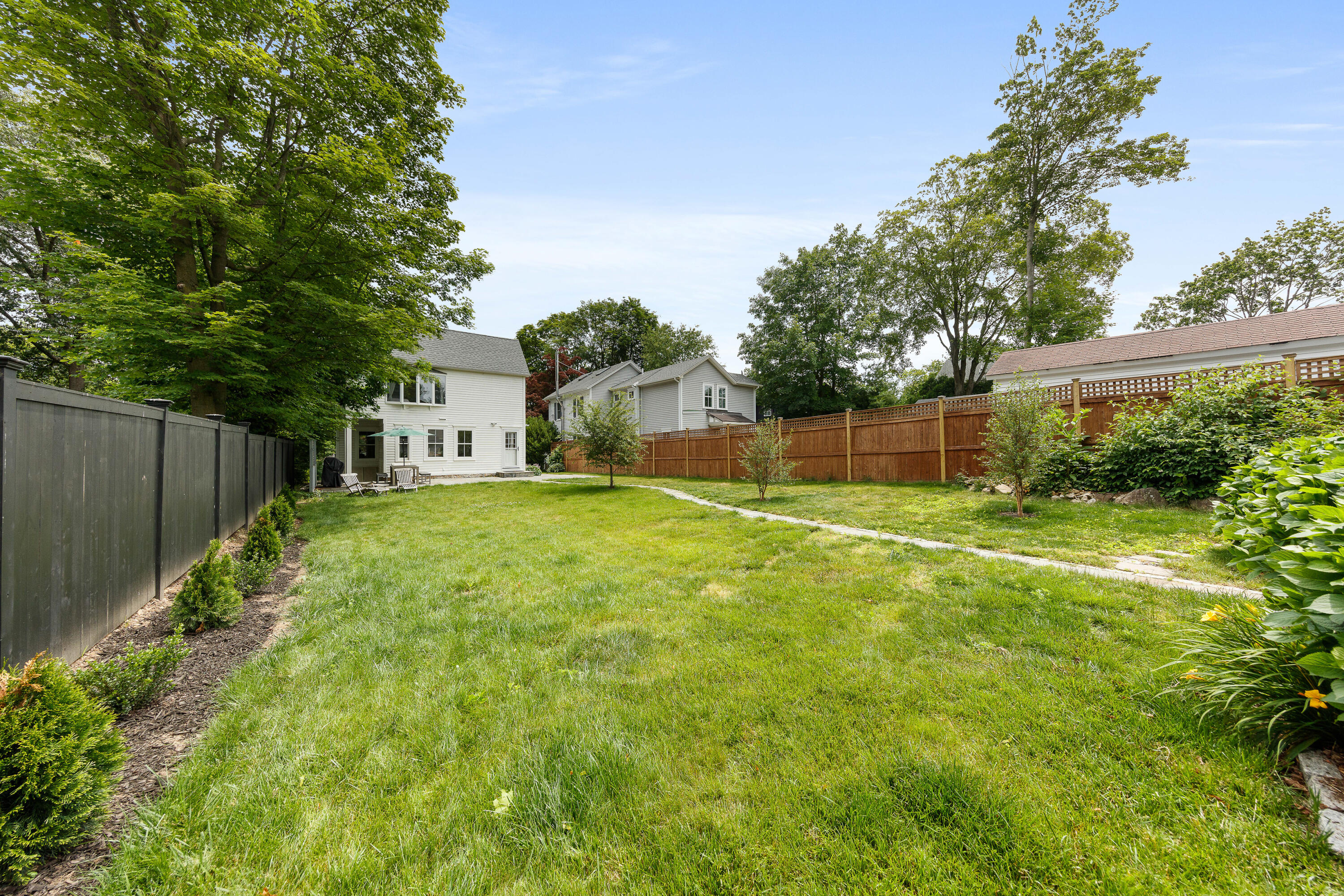 25 Raymond Street Darien, CT 06820 - Photo 19 of 28 a view of a backyard