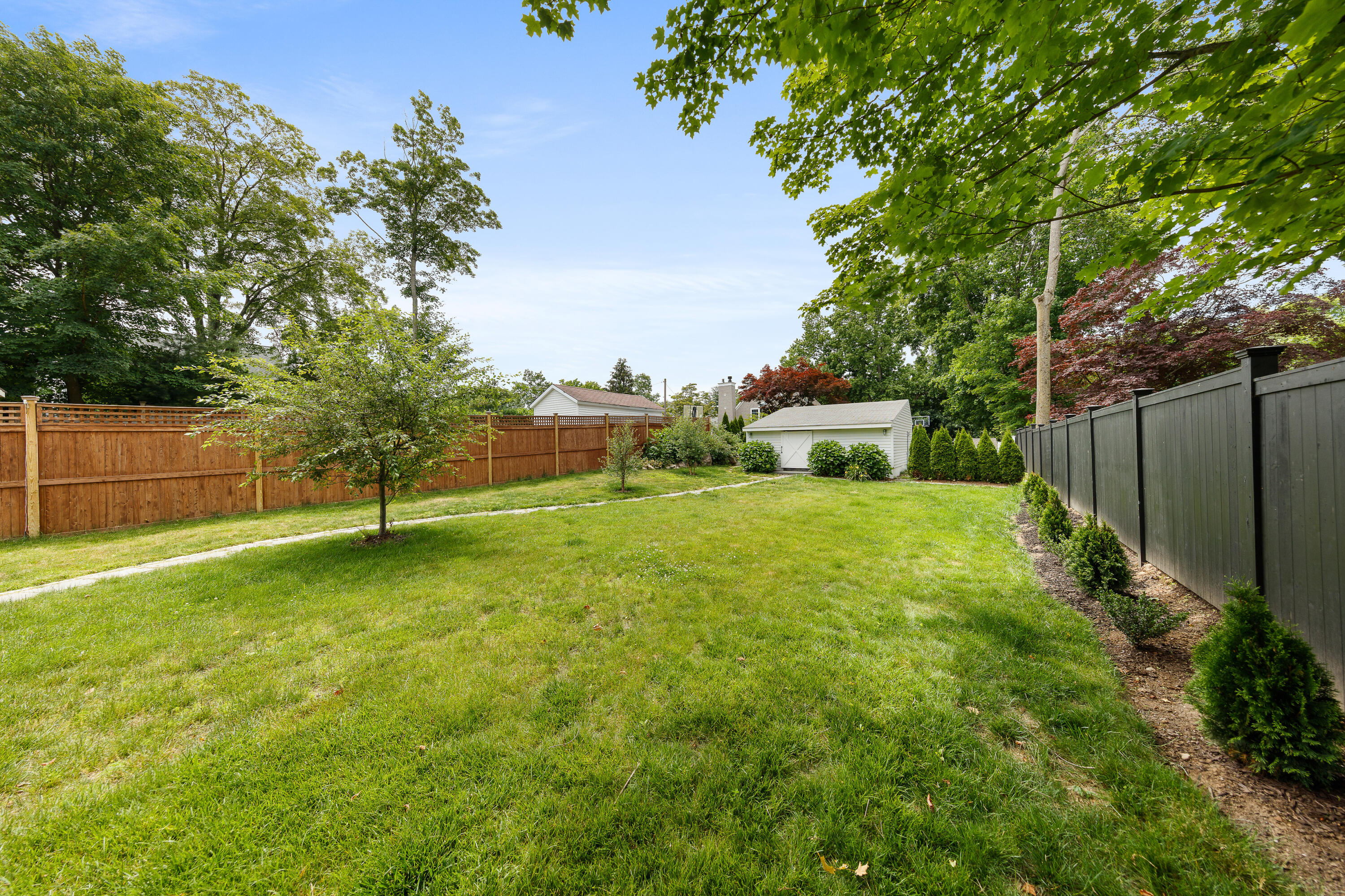 25 Raymond Street Darien, CT 06820 - Photo 20 of 28 a view of backyard with green space