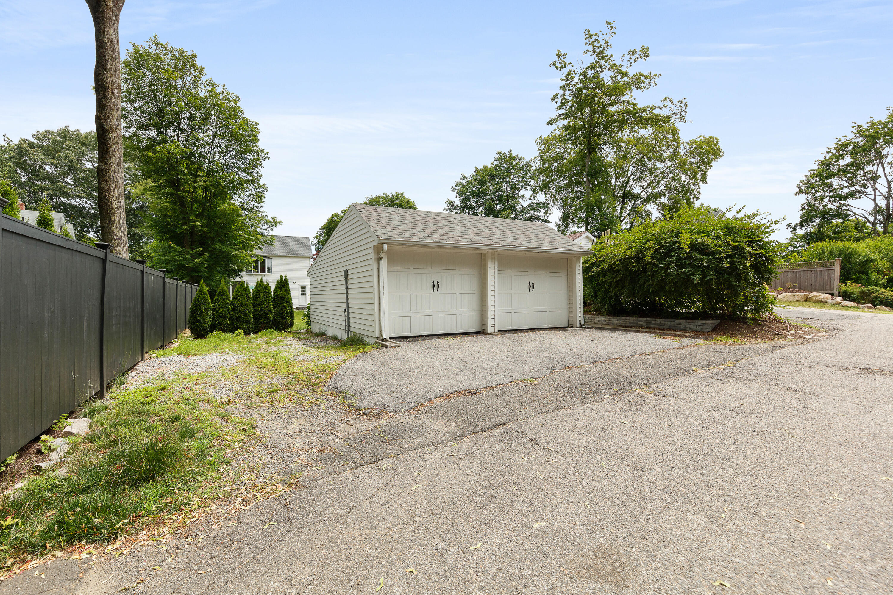 25 Raymond Street Darien, CT 06820 - Photo 21 of 28 a view of a house with a yard and garage