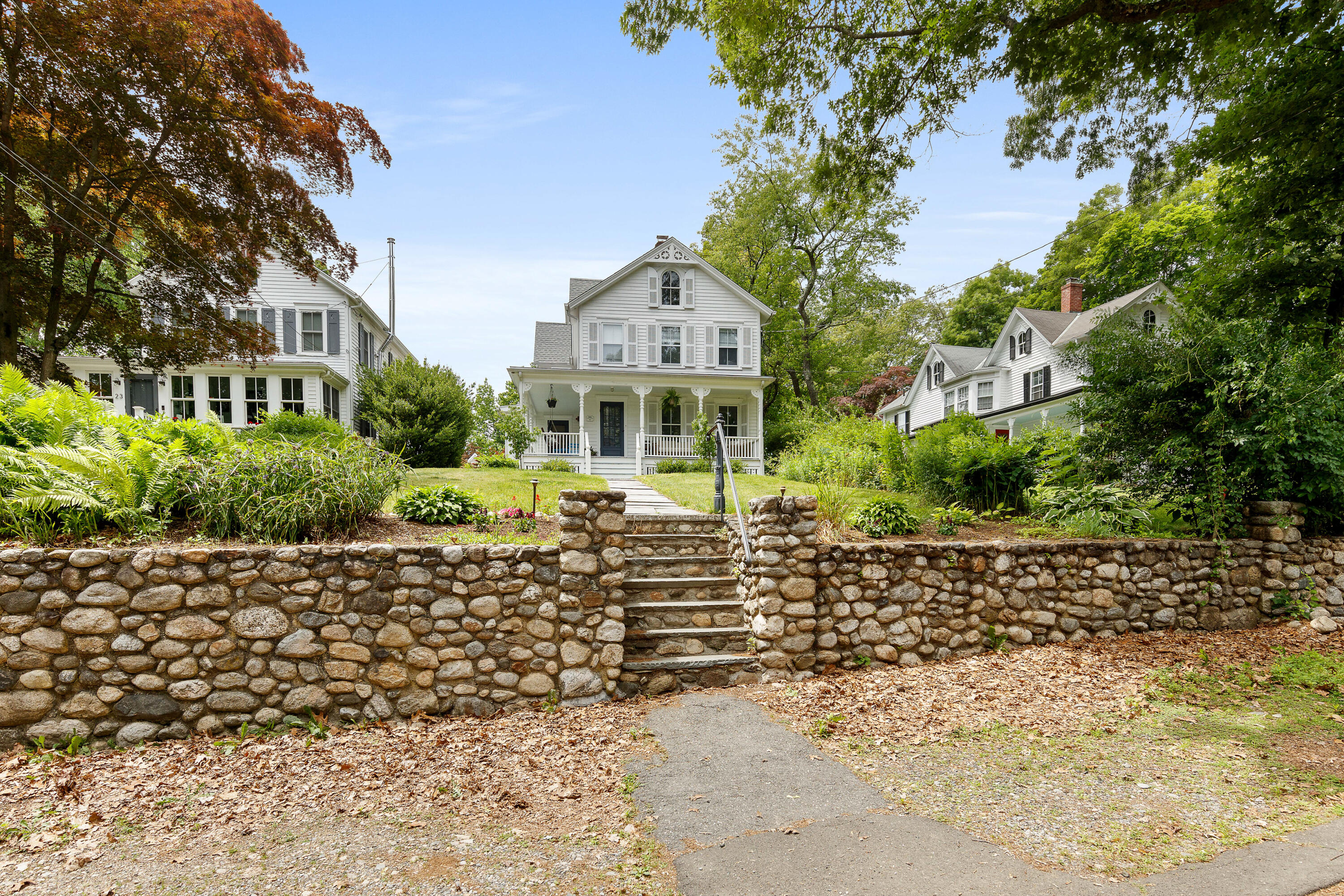 25 Raymond Street Darien, CT 06820 - Photo 23 of 28 a front view of a house with a yard
