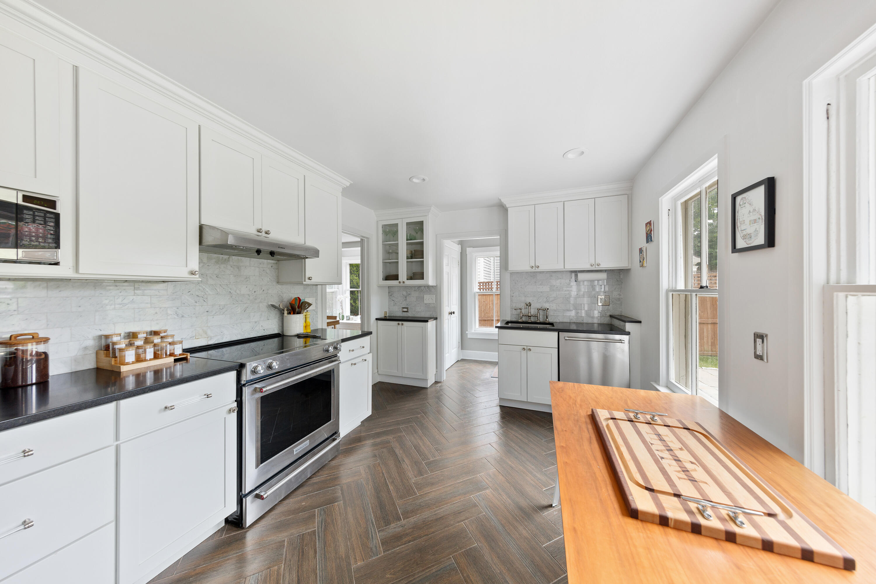 25 Raymond Street Darien, CT 06820 - Photo 9 of 28 a kitchen with stainless steel appliances granite countertop a refrigerator sink and cabinets