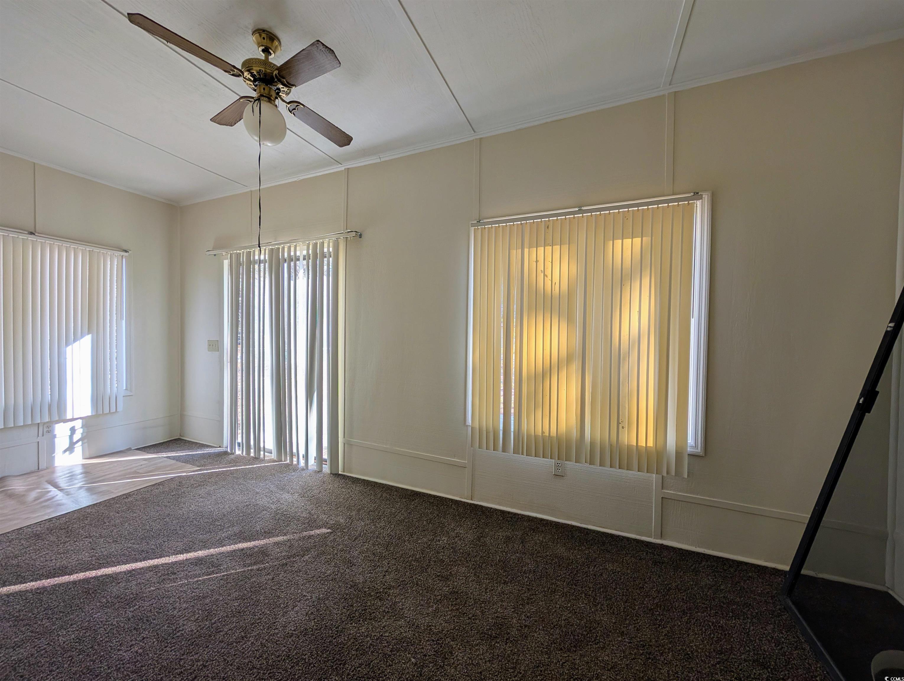 334 County Rd S-22-673 Georgetown, SC 29440 - Photo 11 of 21 Spare room featuring crown molding, a wealth of na