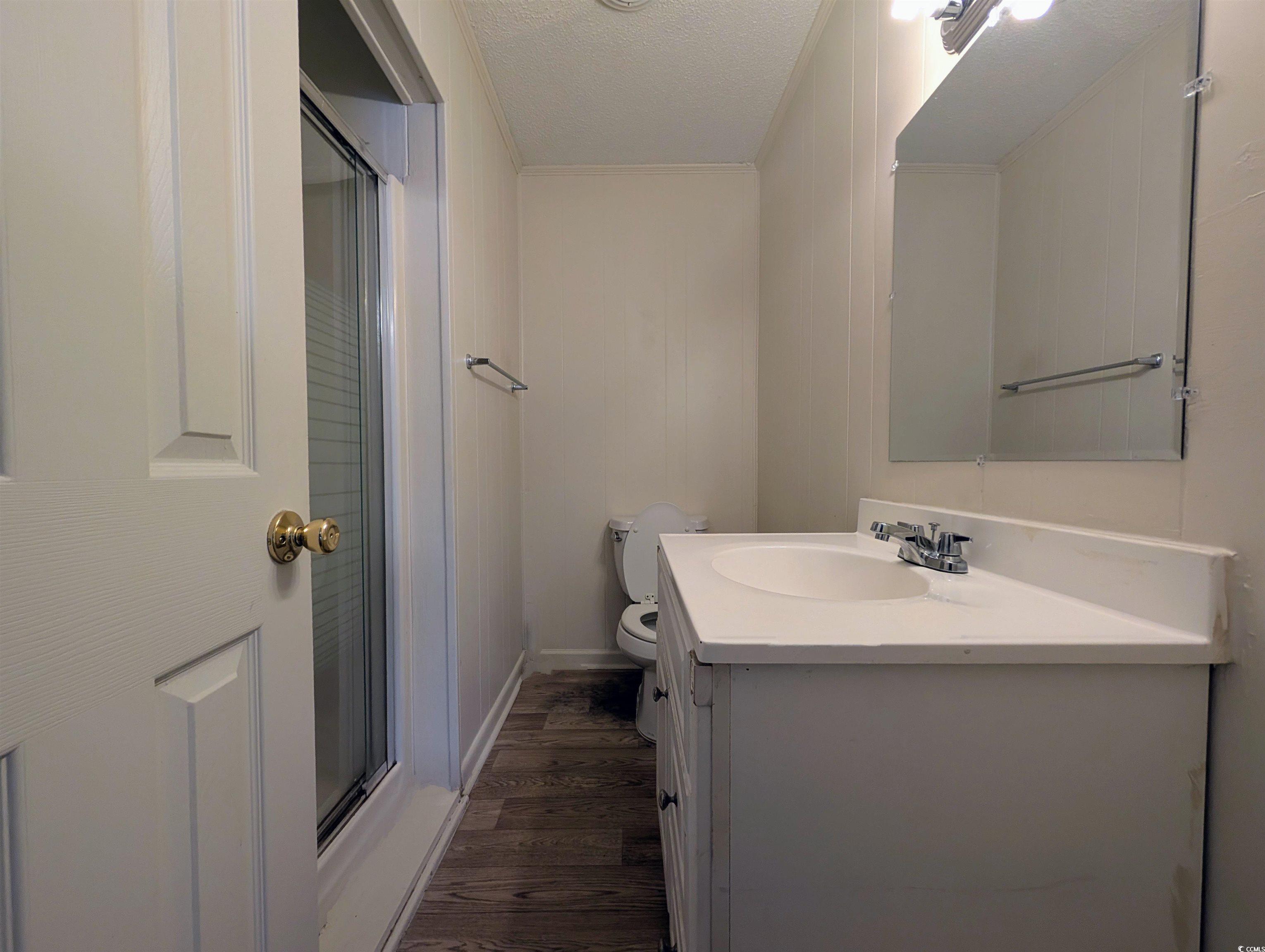 334 County Rd S-22-673 Georgetown, SC 29440 - Photo 17 of 21 Bathroom with hardwood / wood-style flooring, vani