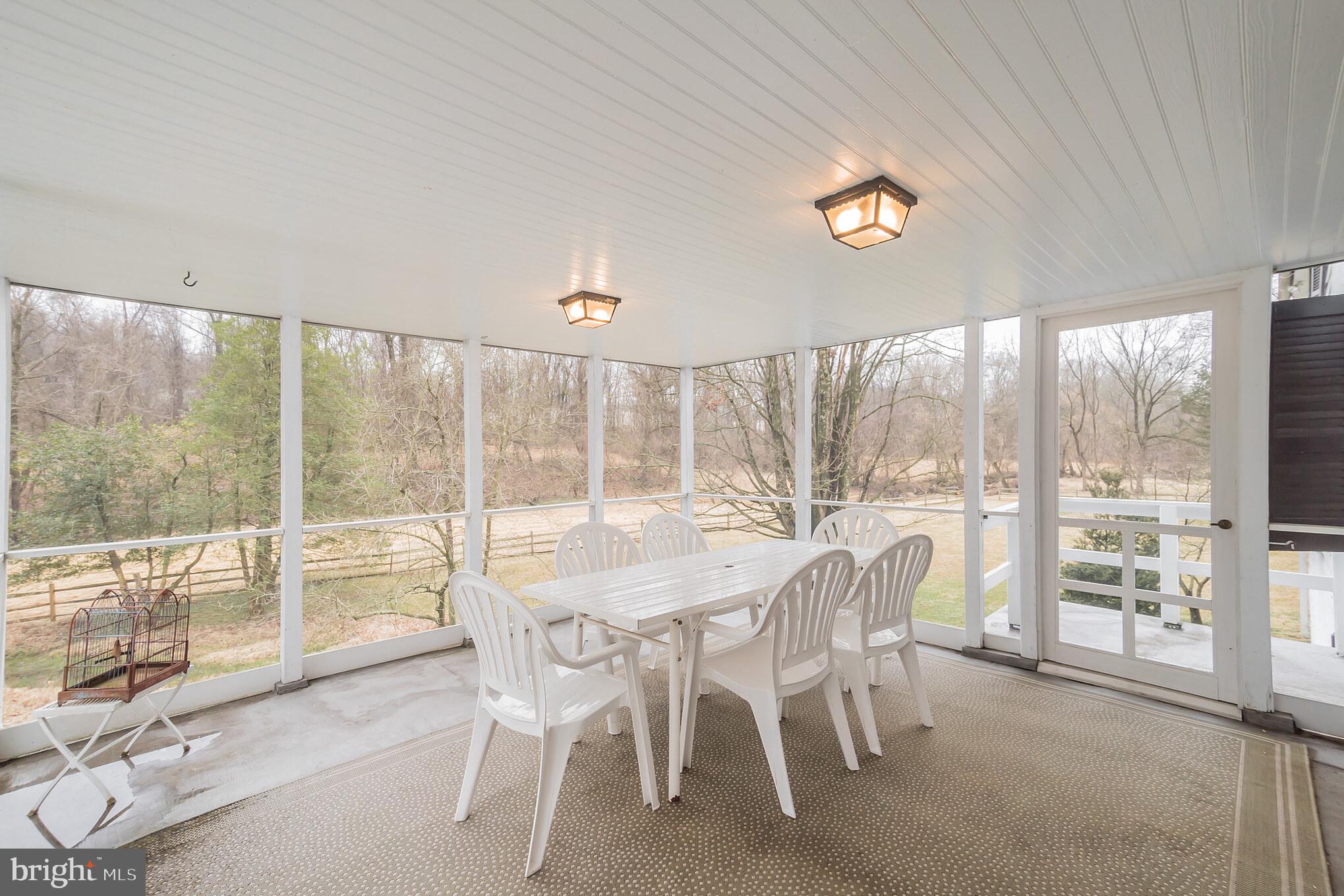 911 North Valley Road Paoli, PA 19301 - Photo 25 of 36 Screened porch leads to the deck