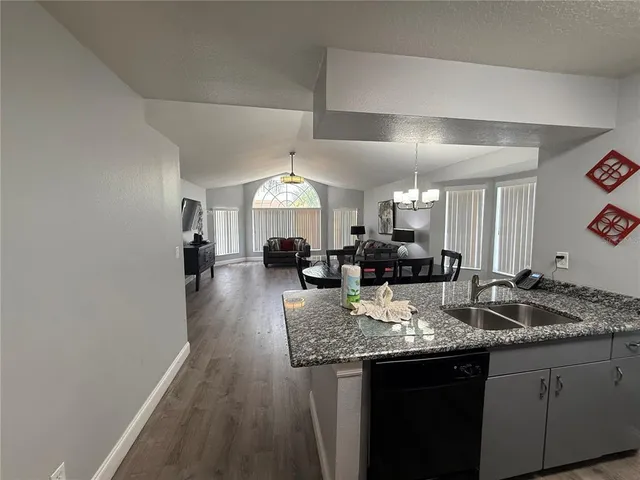 a kitchen with granite countertop lots of counter top space
