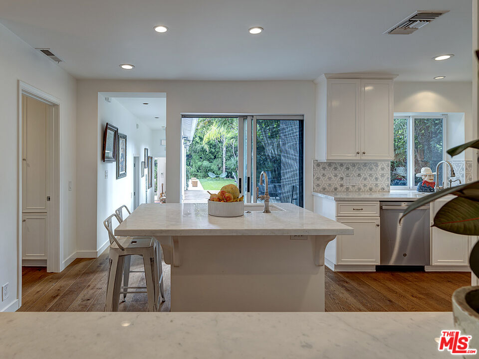 1314 Preston Way Venice, CA 90291 - Photo 14 of 30 a kitchen with a table chairs refrigerator and cabinets