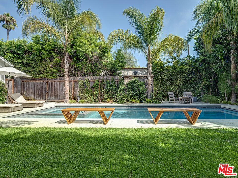 1314 Preston Way Venice, CA 90291 - Photo 30 of 30 a view of a swimming pool with a bench and palm trees