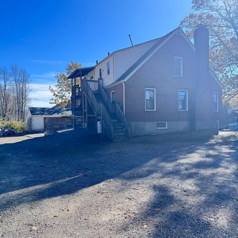 a house view with a backyard
