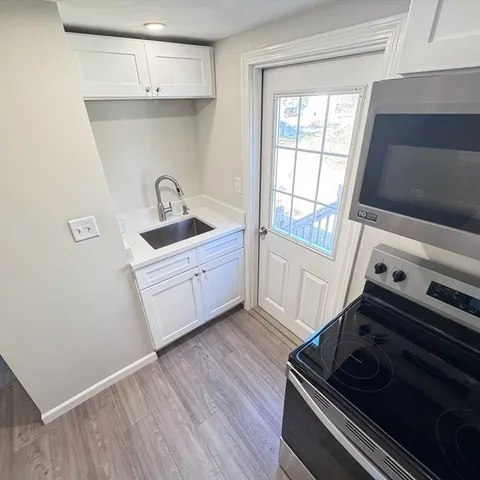 a kitchen with a stove and a microwave