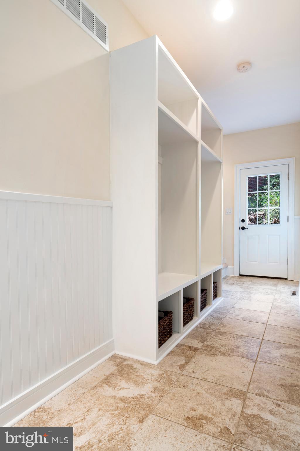 1315 Prospect Hill Road Villanova, PA 19085 - Photo 12 of 24 a view of an empty room with kitchen and windows