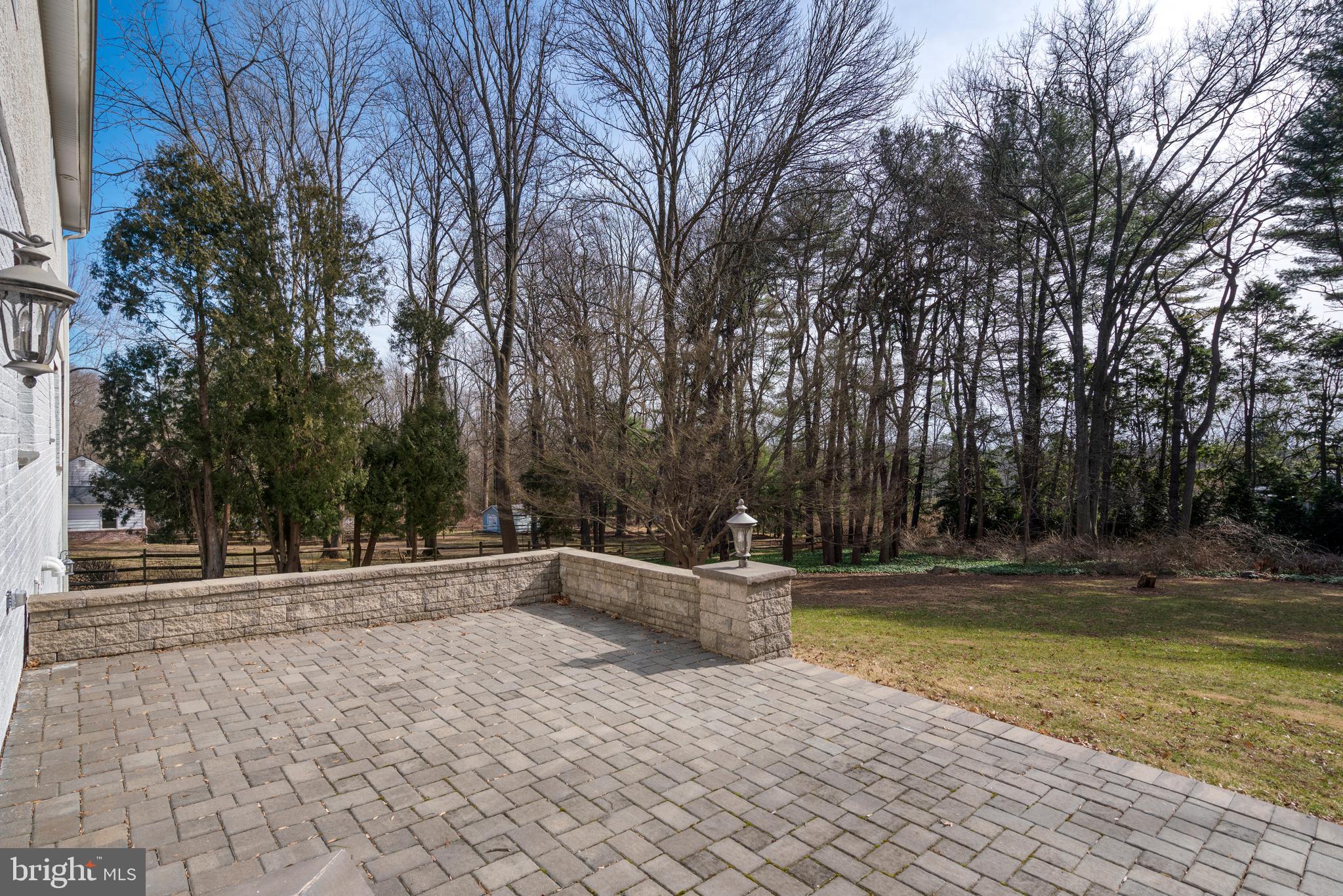 1315 Prospect Hill Road Villanova, PA 19085 - Photo 24 of 24 a backyard of a house with lots of green space and trees