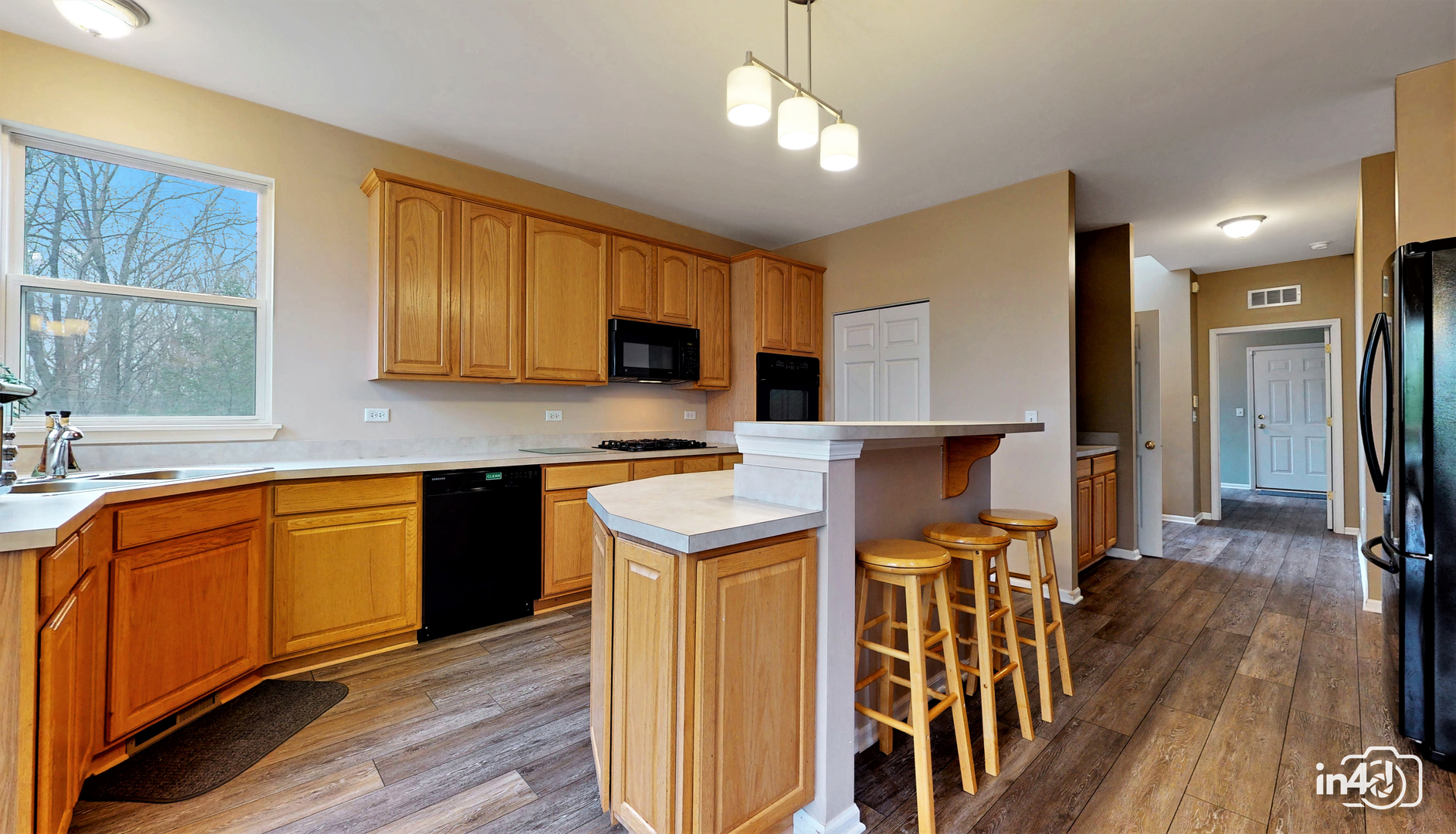 3 Ridge Court Bolingbrook, IL 60440 - Photo 12 of 52 a kitchen with stainless steel appliances granite countertop a refrigerator a stove top oven a sink dishwasher and white cabinets with wooden floor