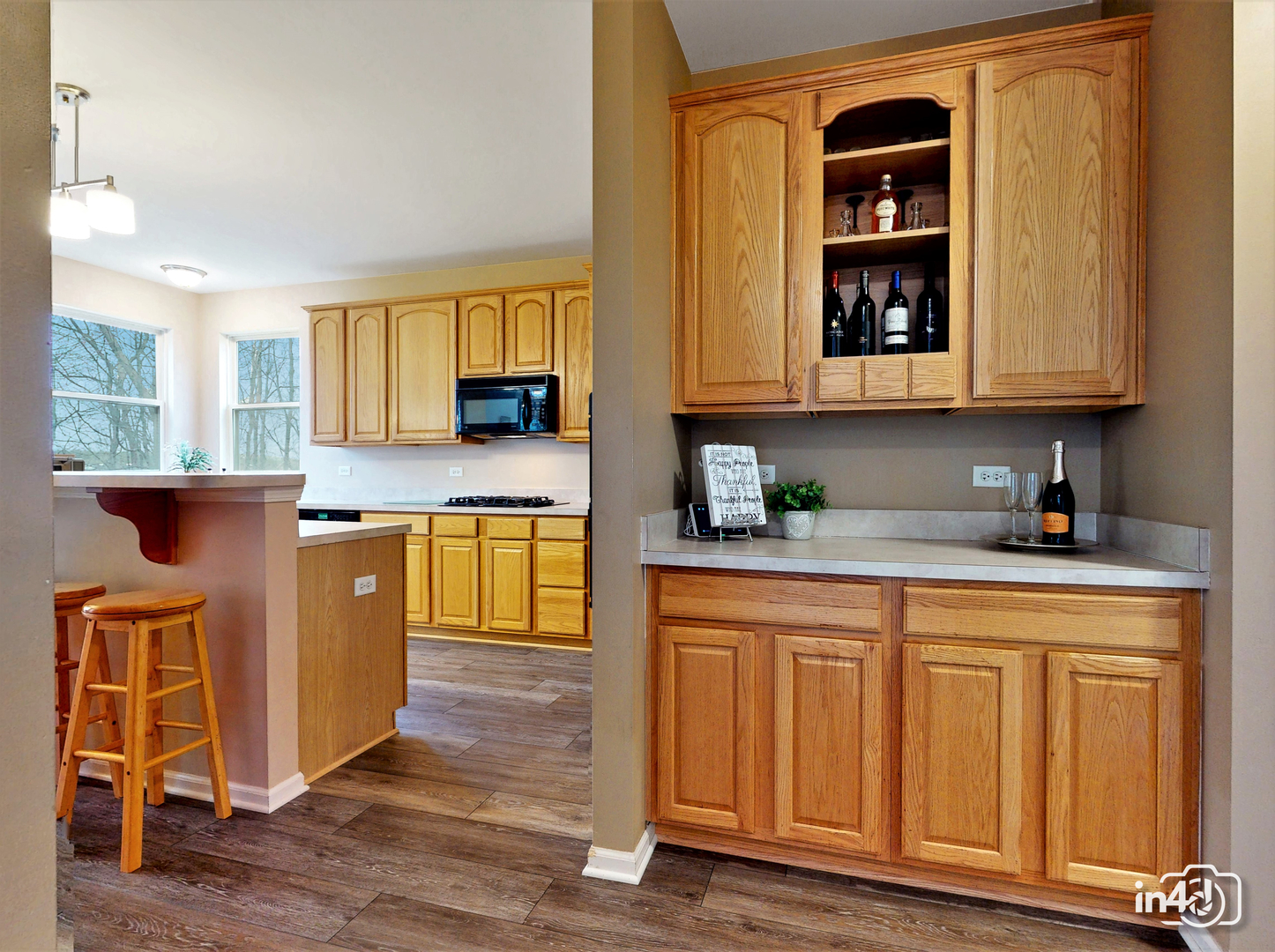 3 Ridge Court Bolingbrook, IL 60440 - Photo 14 of 52 a kitchen with stainless steel appliances granite countertop wooden cabinets and a counter top space