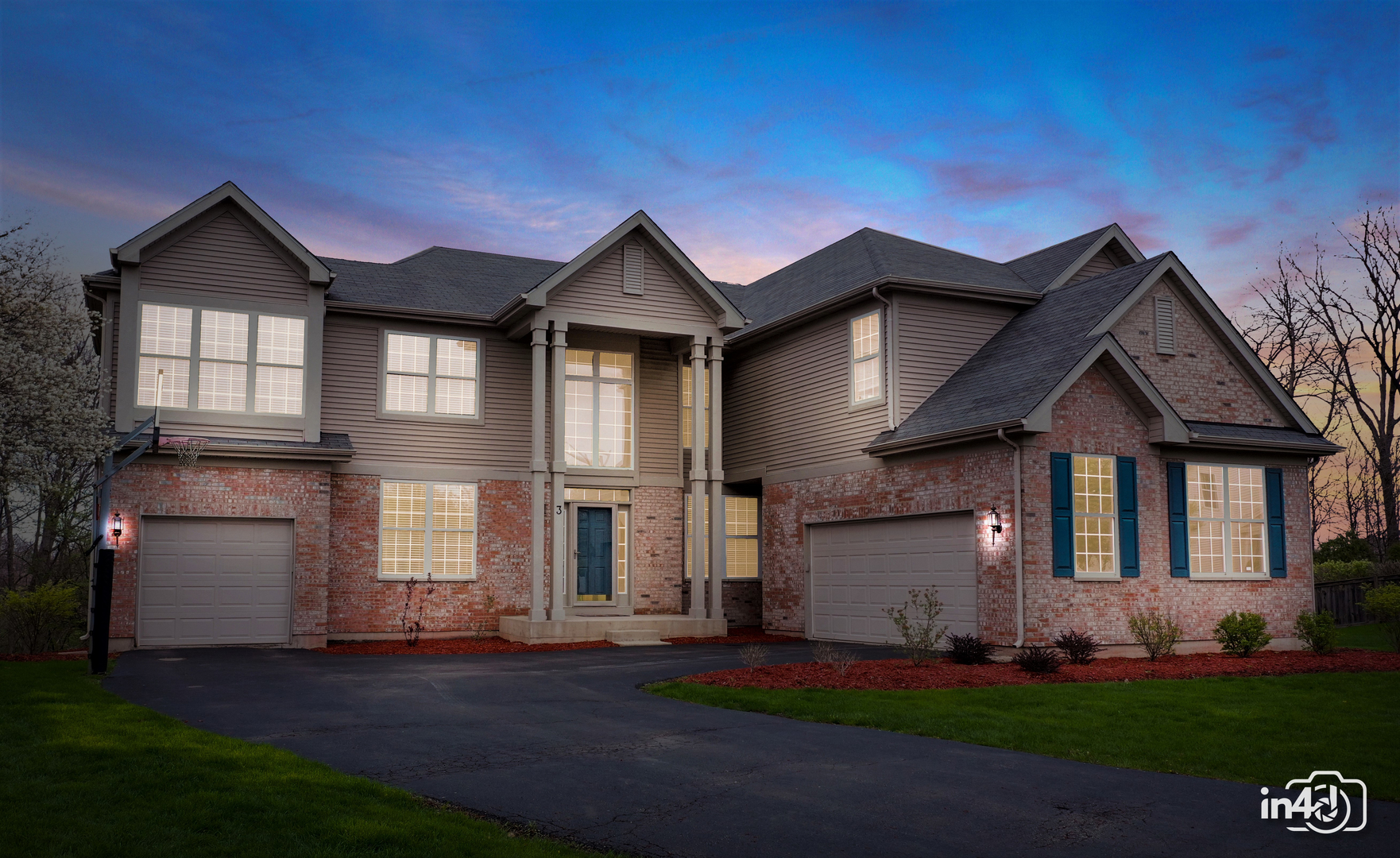 3 Ridge Court Bolingbrook, IL 60440 - Photo 2 of 52 a front view of a house with a yard and garage