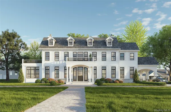 a front view of a residential apartment building with a yard