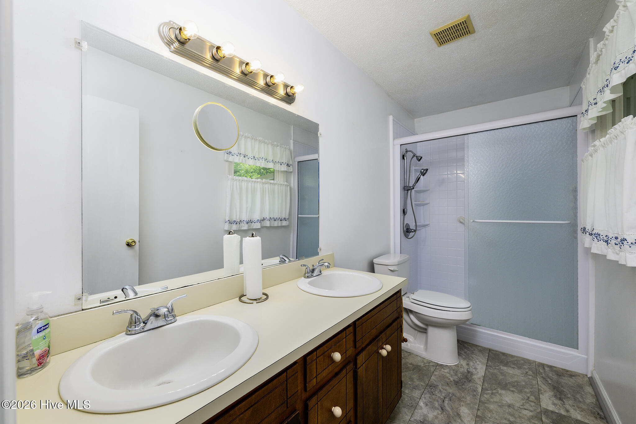 5101 Sand Ridge Road New Bern, NC 28560 - Photo 24 of 48 En Suite Primary Bathroom with Walk-in Shower & Dual Sink Vanity