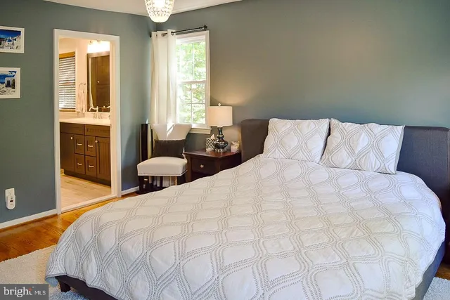 a bed room with a bed and a window