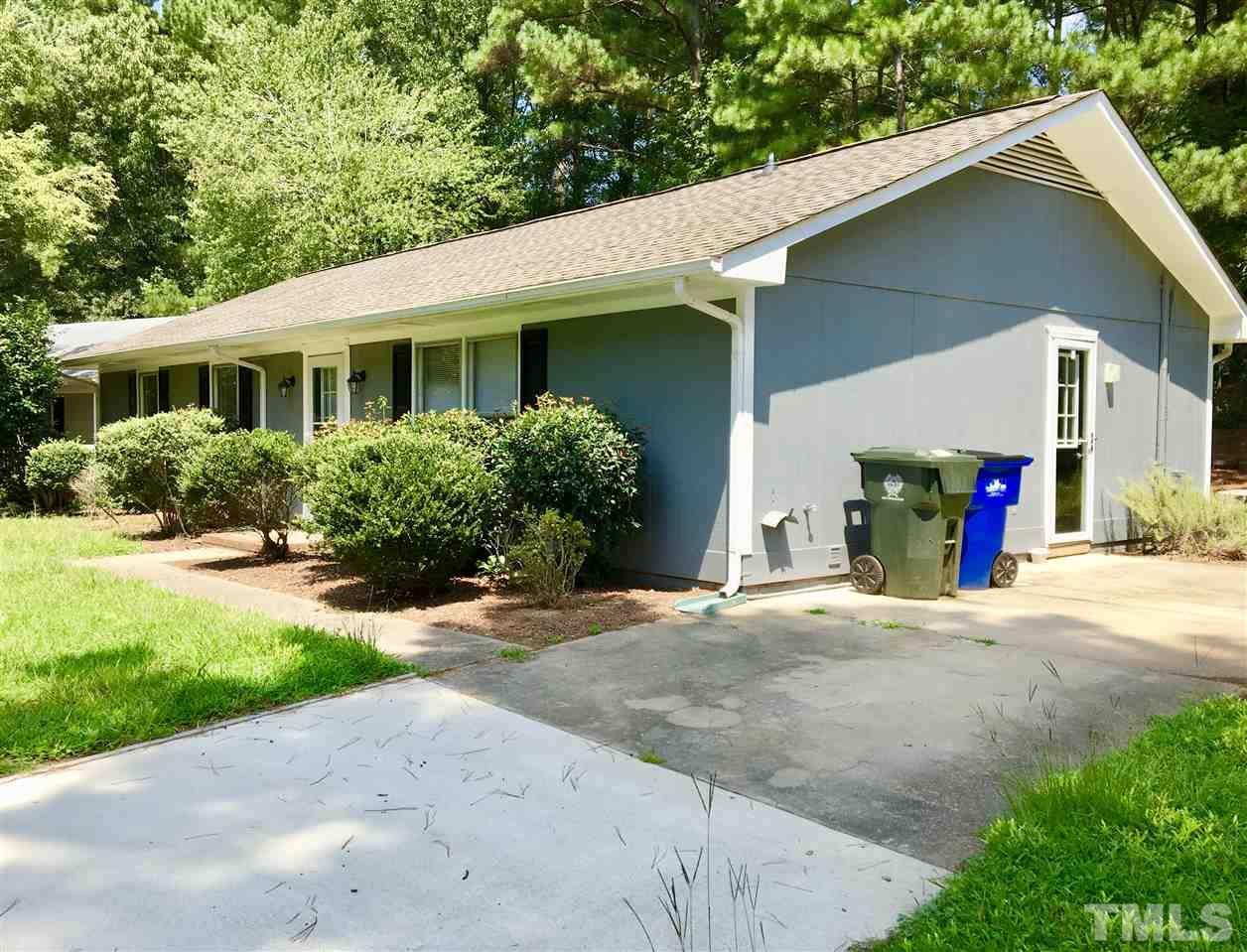 6504 Keystone Drive Raleigh, NC 27612 - Photo 3 of 17 a front view of a house with a yard and garage