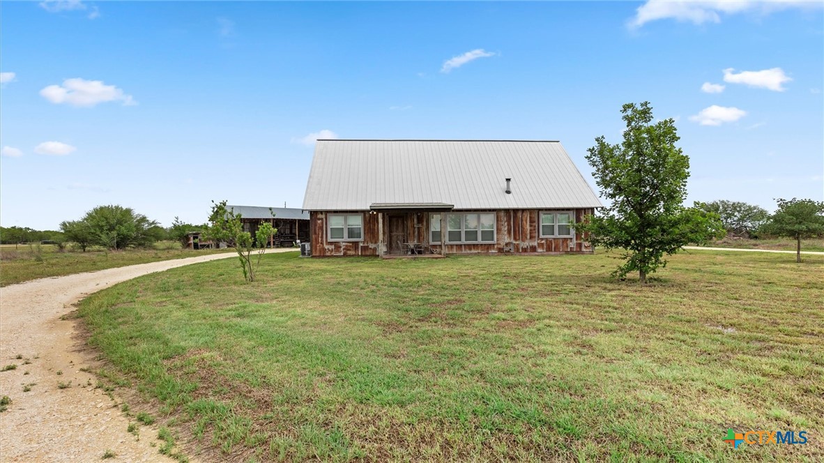 707 Creek Road Marion, TX 78124 - Photo 1 of 32 a view of a house with a yard