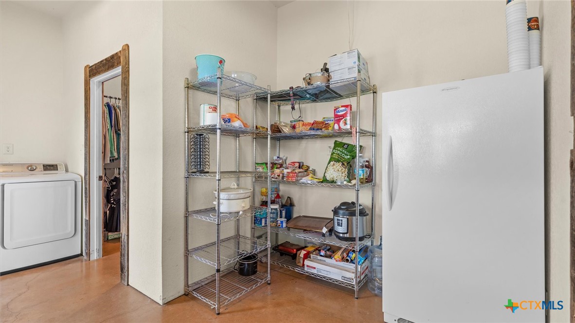707 Creek Road Marion, TX 78124 - Photo 13 of 32 a room with storage and utility