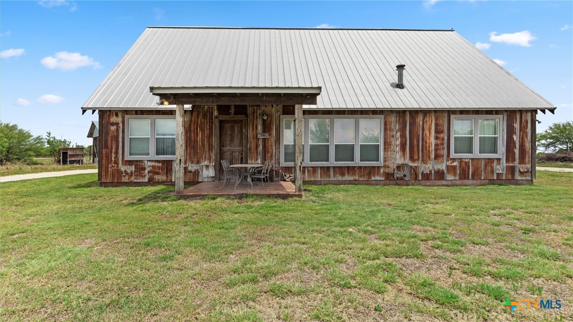 707 Creek Road Marion, TX 78124 - Photo 2 of 32 a view of a house with backyard and porch
