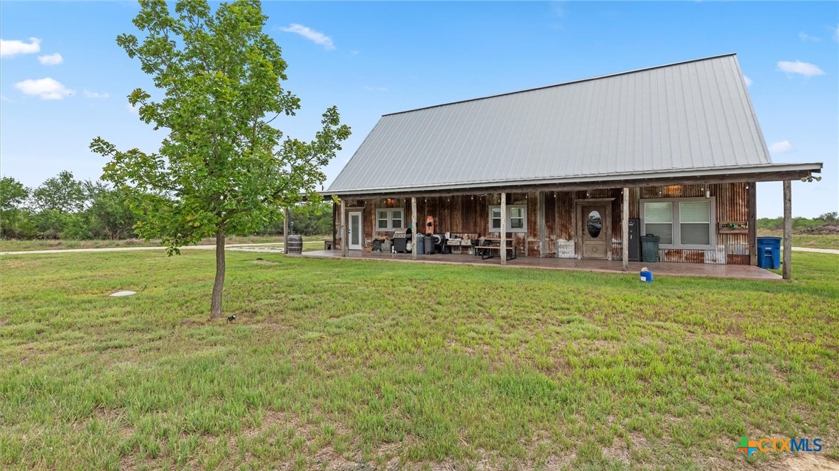 707 Creek Road Marion, TX 78124 - Photo 23 of 32 a view of a house with a yard porch and sitting area