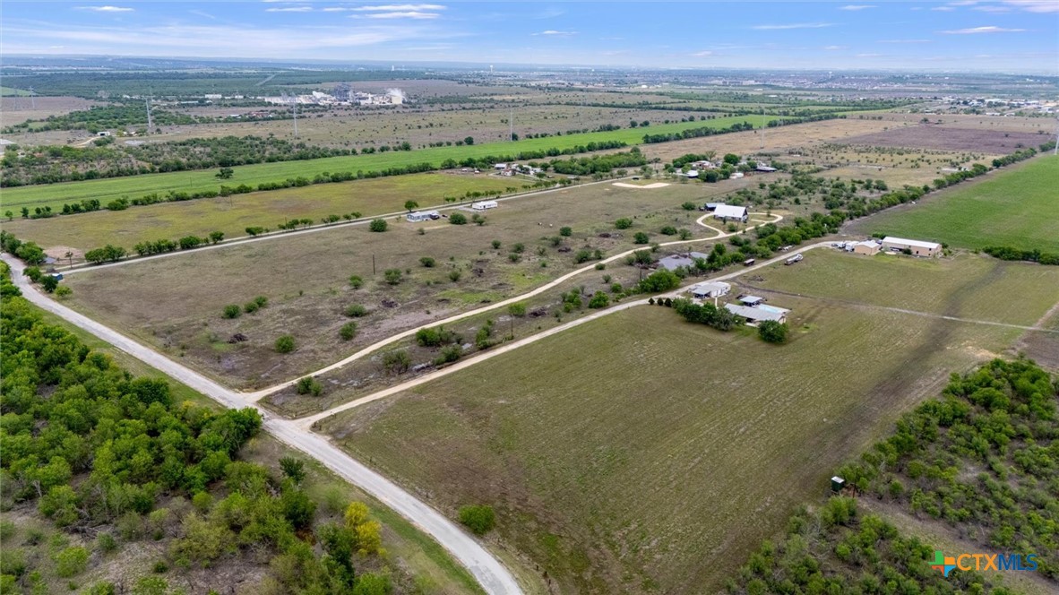 707 Creek Road Marion, TX 78124 - Photo 29 of 32 an aerial view of residential houses with outdoor space and mountain view