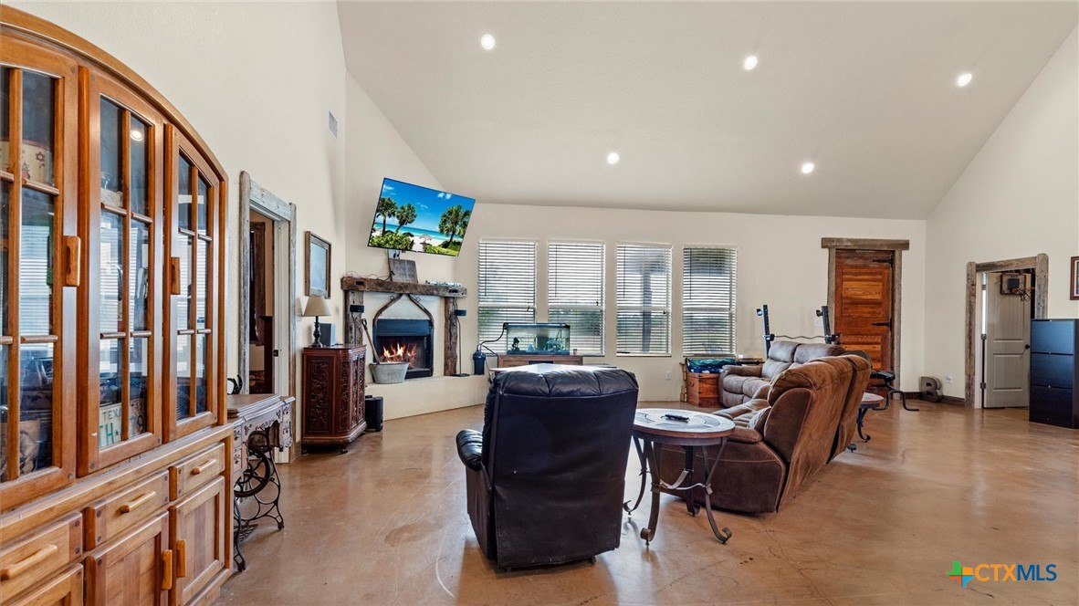 707 Creek Road Marion, TX 78124 - Photo 5 of 32 a living room with furniture fireplace and flat screen tv