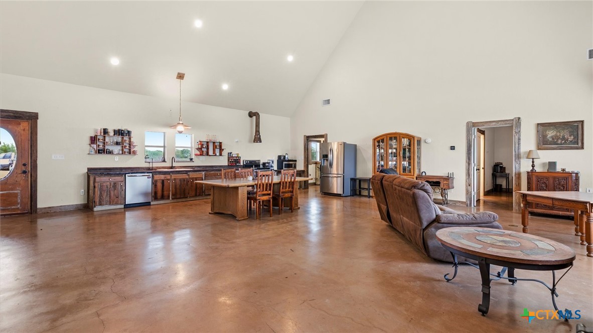707 Creek Road Marion, TX 78124 - Photo 7 of 32 a living room with furniture and a wooden floor