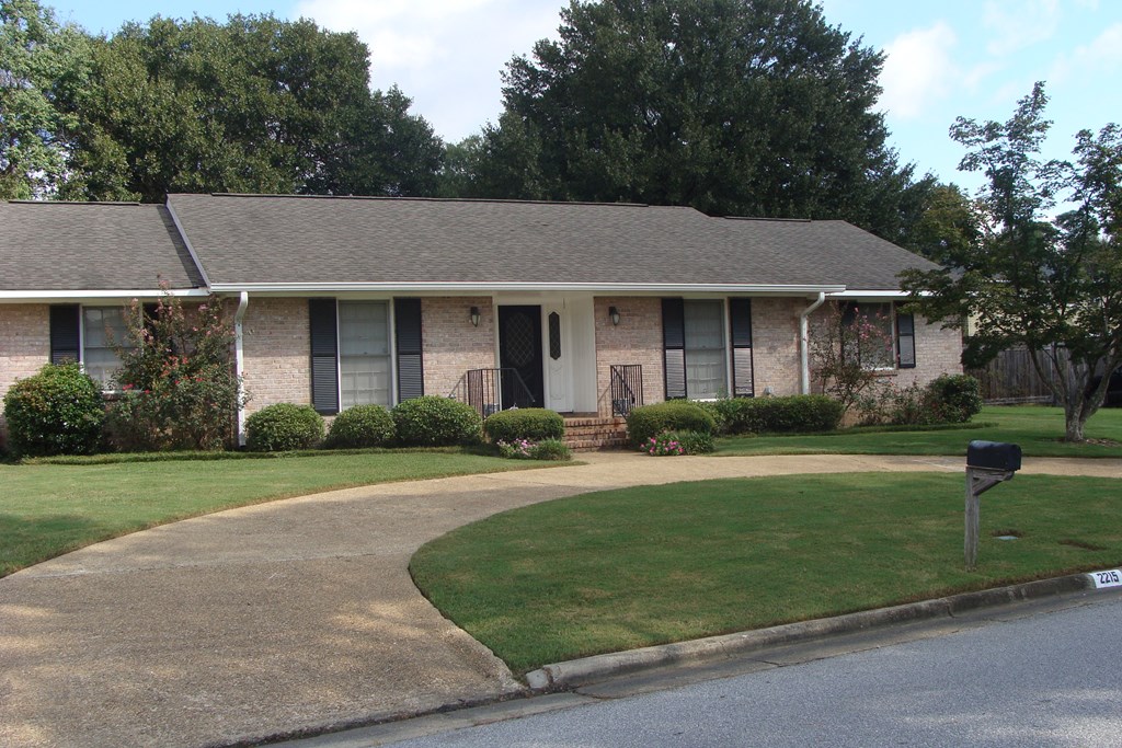 2215 Coventry Drive Columbus, GA 31904 - Photo 2 of 24 a front view of a house with a yard