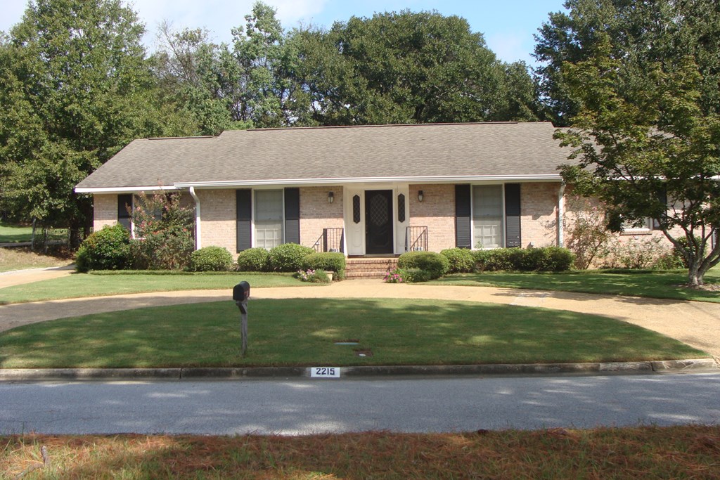 2215 Coventry Drive Columbus, GA 31904 - Photo 3 of 24 a front view of a house with garden