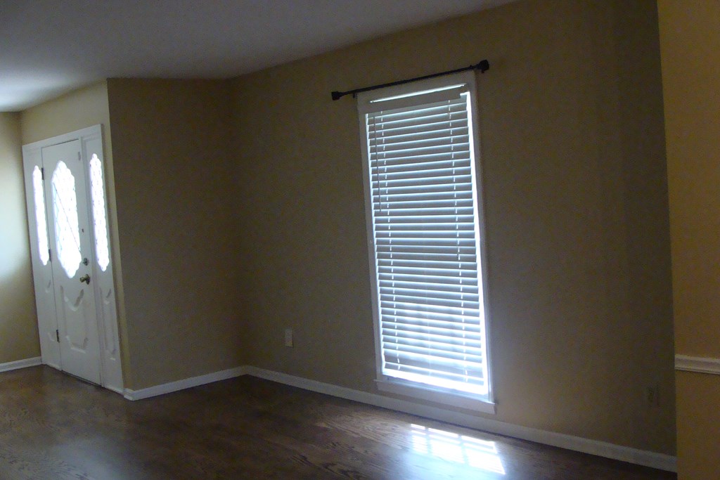 2215 Coventry Drive Columbus, GA 31904 - Photo 10 of 24 an empty room with wooden floor and a window