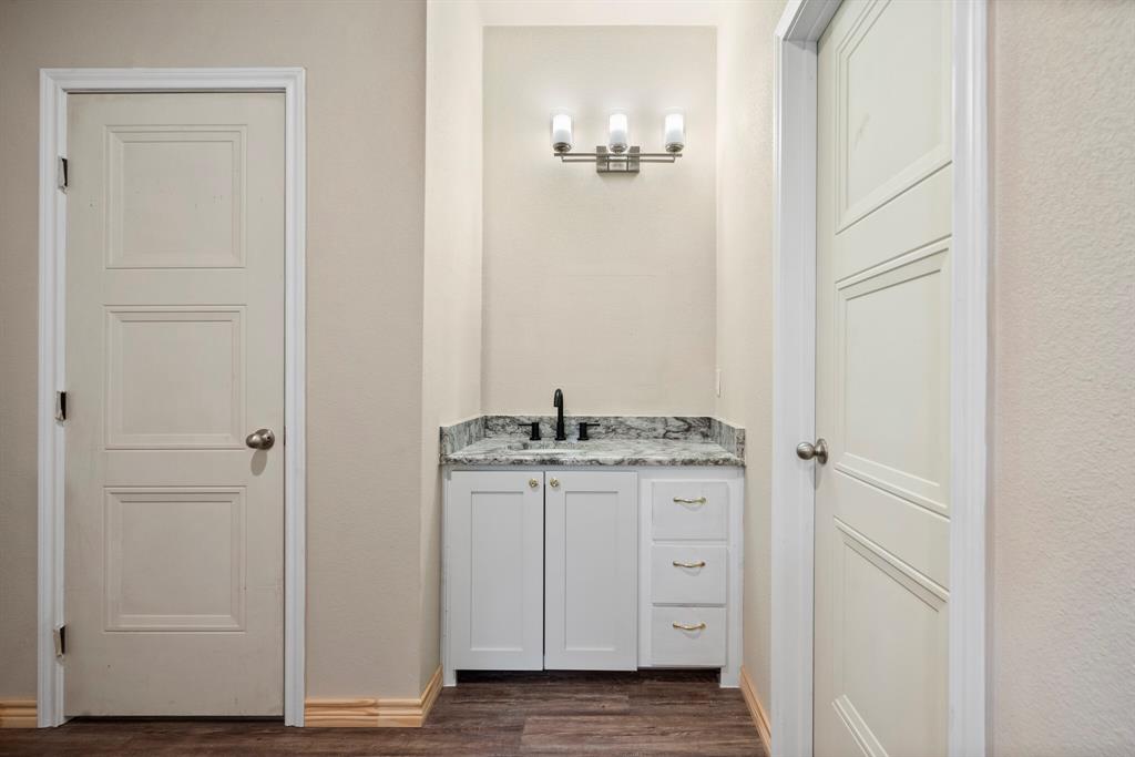 2877 Conveyor Drive, Unit B Burleson, TX 76028 - Photo 13 of 22 Indoor wet bar featuring dark wood-style floors