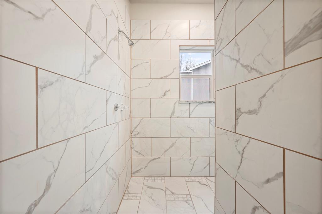 2877 Conveyor Drive, Unit B Burleson, TX 76028 - Photo 16 of 22 Bathroom with tiled shower