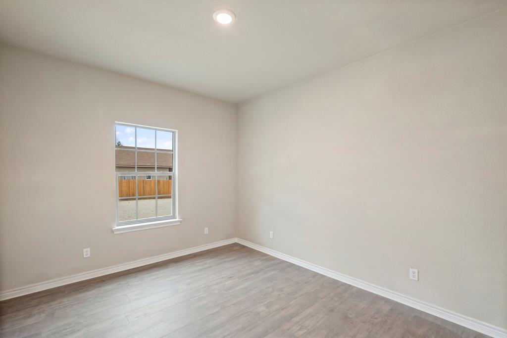 2877 Conveyor Drive, Unit B Burleson, TX 76028 - Photo 17 of 22 Empty room featuring wood finished floors and recessed lighting