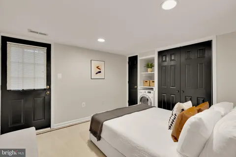 a bedroom with a bed and a closet