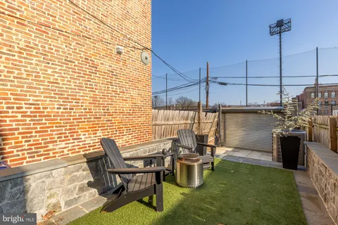a view of a chairs and table in patio