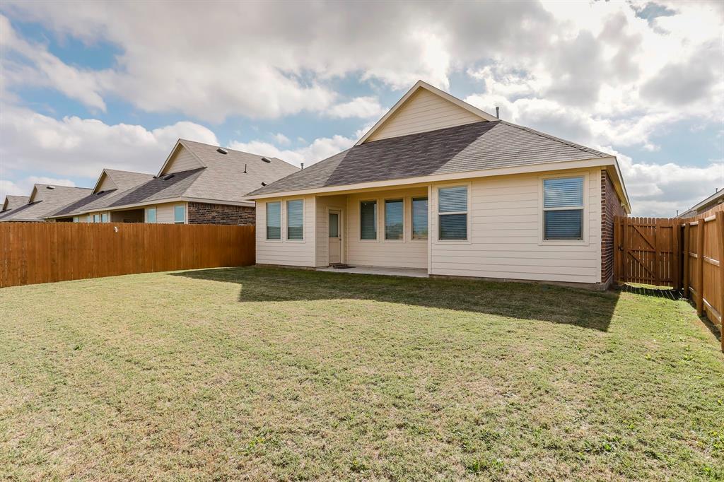 652 Ridgeback Trail Fort Worth, TX 76052 - Photo 18 of 20 Back of house with a lawn