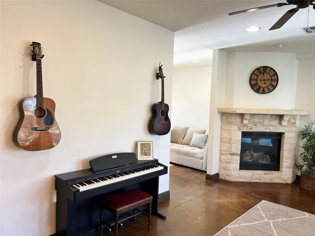a living room with furniture and a fireplace