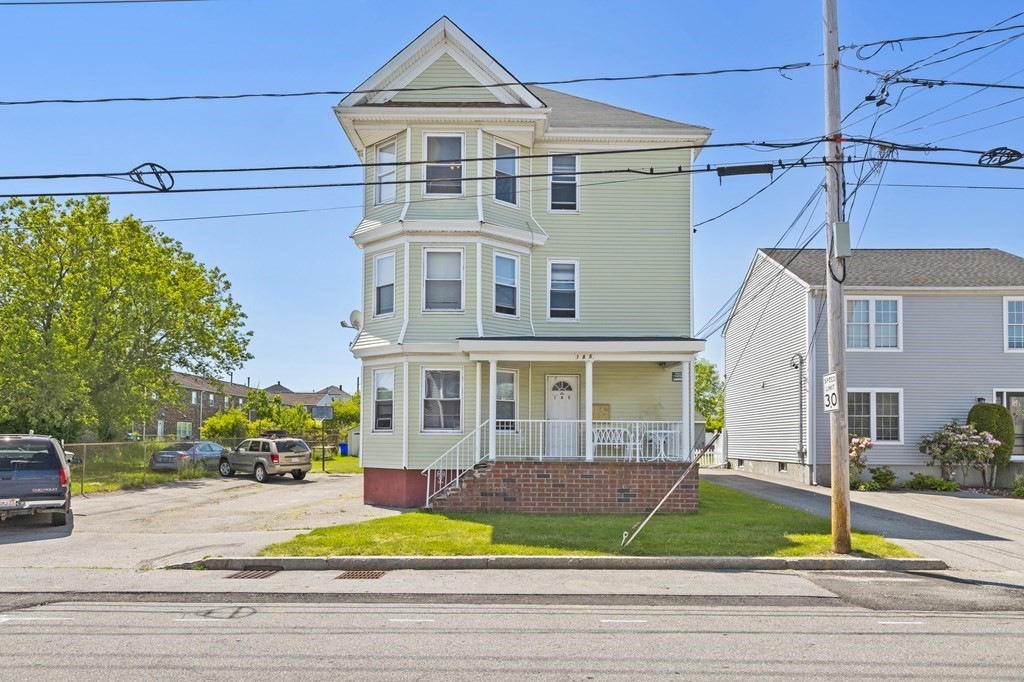 front view of a house with a yard