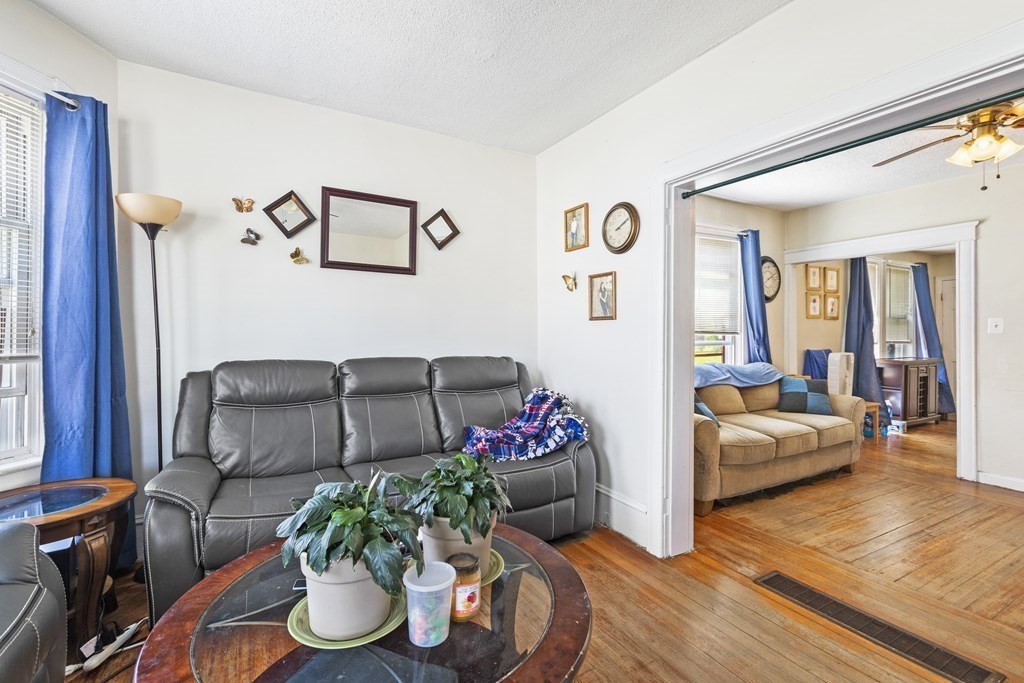 185 Stevens Street Fall River, MA 02721 - Photo 18 of 28 a living room with furniture and wooden floor